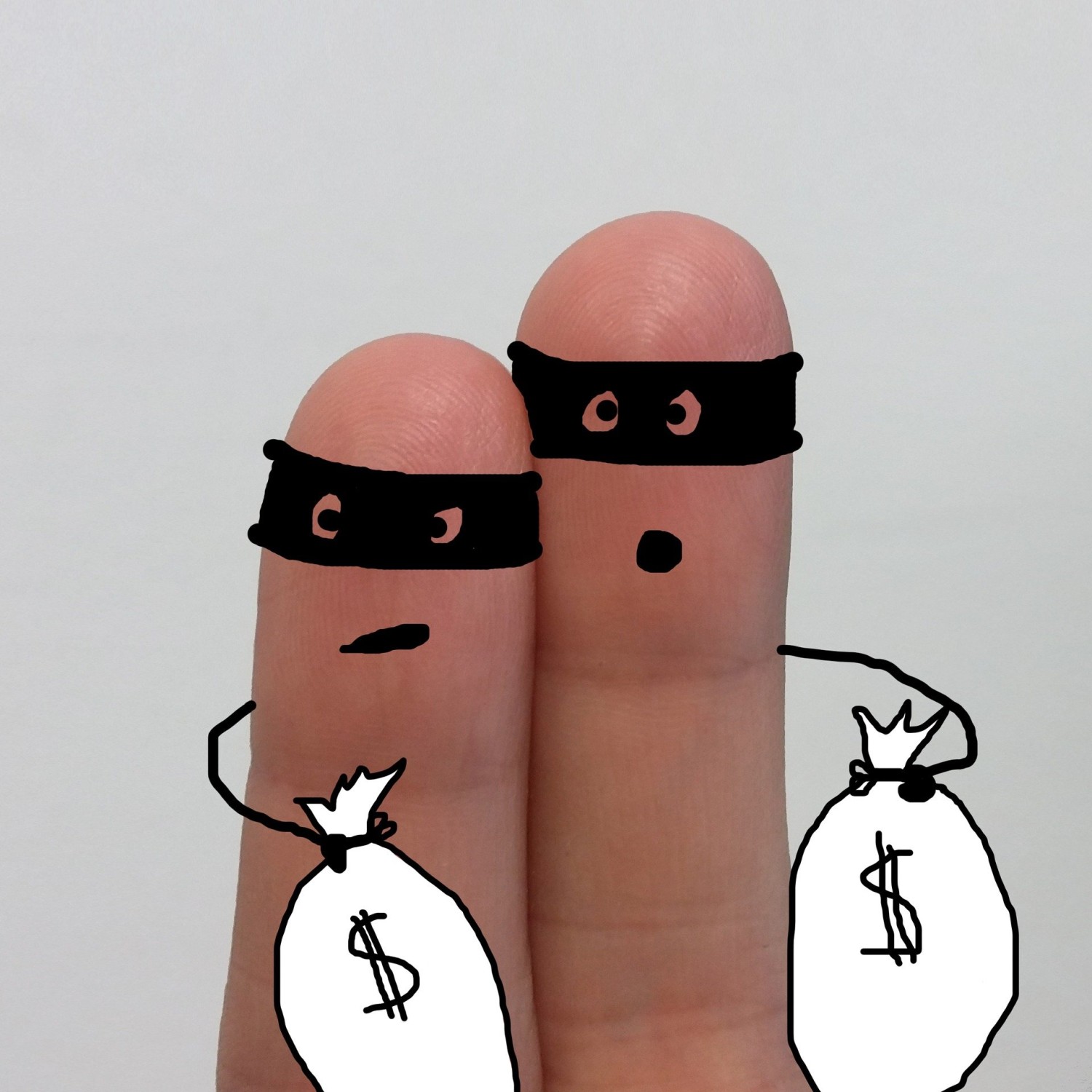 Two robbers holding loot